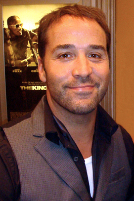 Jeremy Piven standing in front of the movie poster - The Kingdom